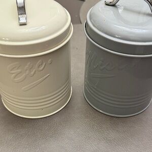 Cream and Gray Metal Canisters